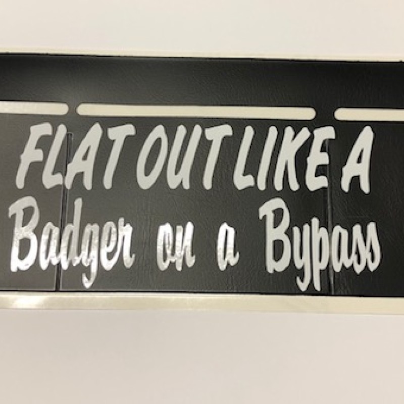 Flat out like a badger on a bypass, tax disc holder.  Flat out like a badger on a bypass, tax disc holder.